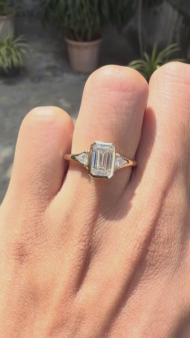 Emerald cut lab grown diamond 3 stone bezel ring 14k yellow gold