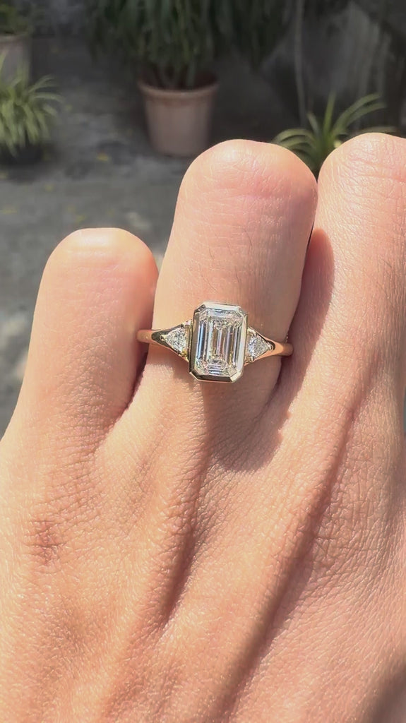 Emerald cut lab grown diamond 3 stone bezel ring 14k yellow gold