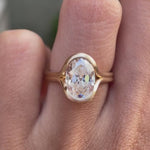 Matte yellow gold oval moissanite half bezel ring video