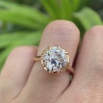 Rotating view of solitaire ring showing front, side, and setting details