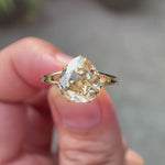 Pear old mine cut light champagne moissanite split shank solitaire engagement ring in 10K yellow gold shown in rotating video