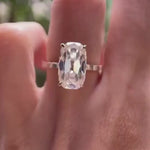 Elongated cushion moissanite ring with accent stone rotating view