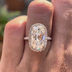 Elongated cushion old mine cut moissanite halo engagement ring with pavé band in 10K yellow gold shown in rotating video