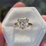 Elongated cushion Old Mine cut moissanite solitaire ring in 14K yellow gold rotating view highlighting faceting and setting detail