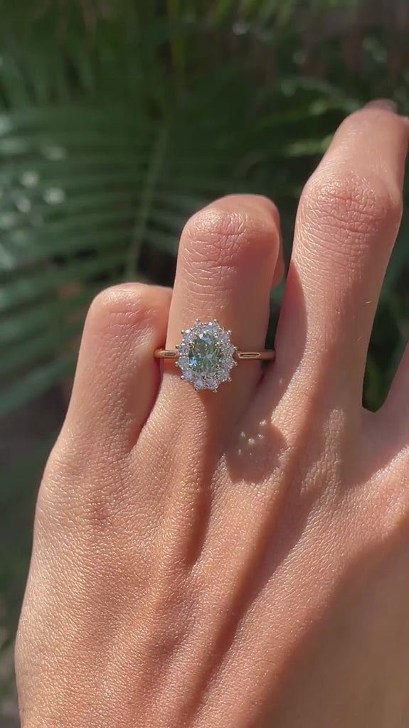Blue green moissanite halo engagement ring on fingure video