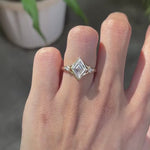 Lozenge cut moissanite trilogy engagement ring, kite side stones, 14k yellow gold