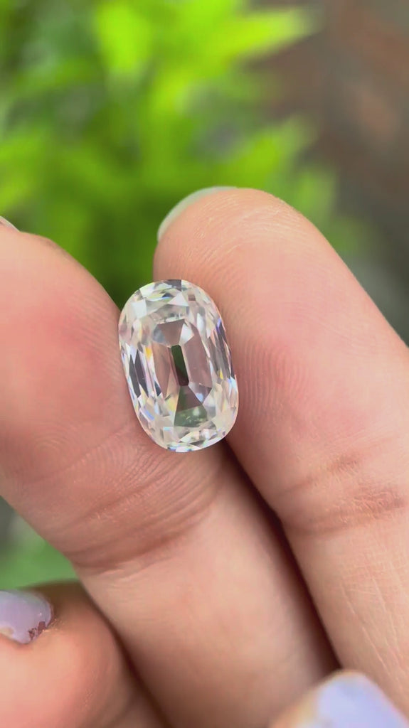 elongated cushion old mine cut moissanite rotating showing sparkle