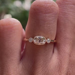 Elongated cushion old mine cut moissanite three stone engagement ring with milgrain bezel in 10K yellow gold shown in rotating video