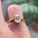 Close-up rotation highlighting cathedral setting and champagne moissanite