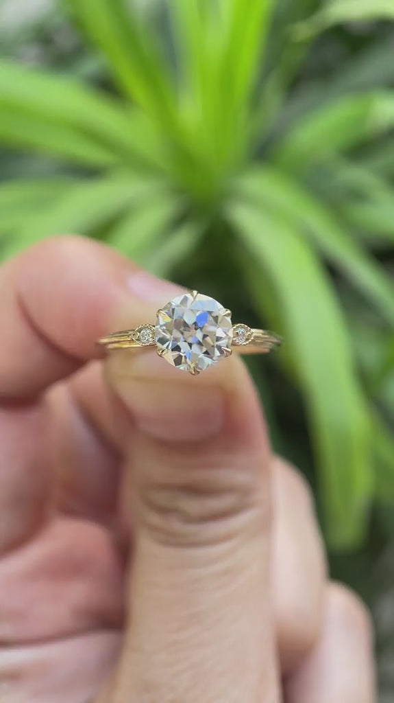 Three stone round Old European cut moissanite engagement ring in 10K yellow gold