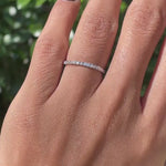 Rotating video of minimalist pave set dainty wedding band showing sparkle and slim design