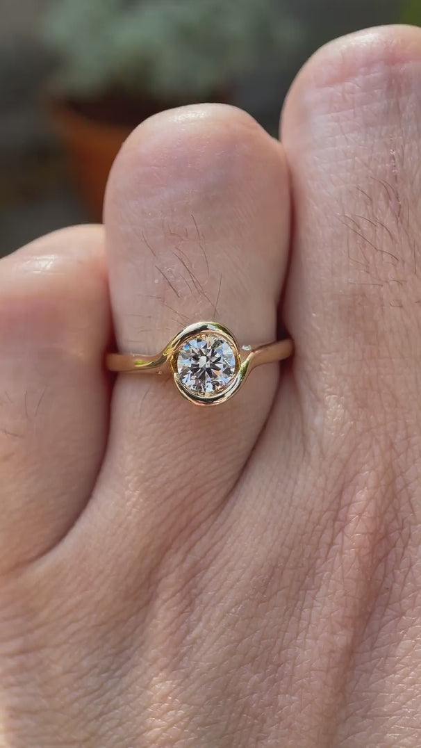 Video showcasing round lab grown diamond solitaire engagement ring in 14K yellow gold