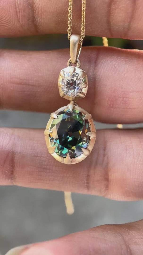 Antique style vertical dangling moissanite pendant front view video