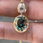 Antique style vertical dangling moissanite pendant front view video
