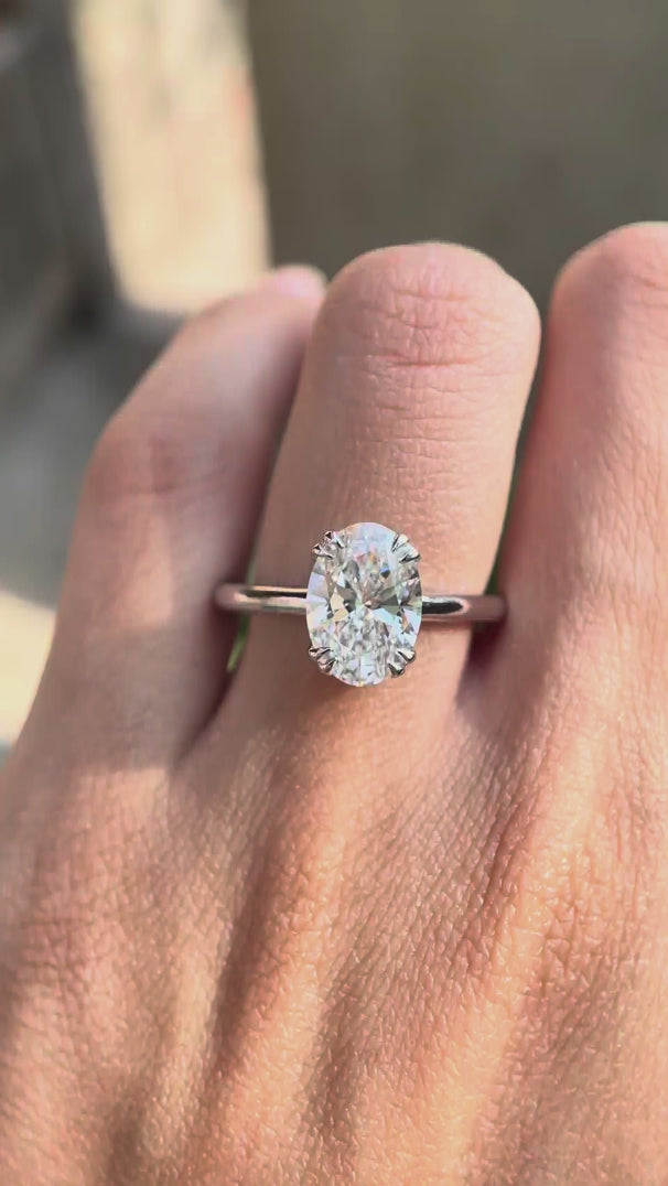 Product video showcasing the oval lab grown diamond solitaire ring in 14K white gold from multiple angles.