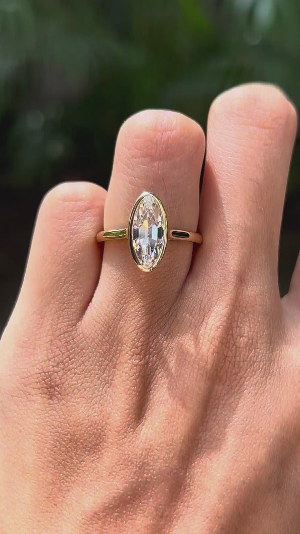 Rotating view of moval bezel set lab diamond engagement ring