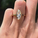 Rotating view of moval bezel set lab diamond engagement ring