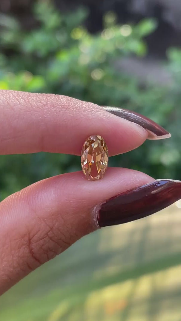 Old mine cut oval light champagne moissanite rotating view
