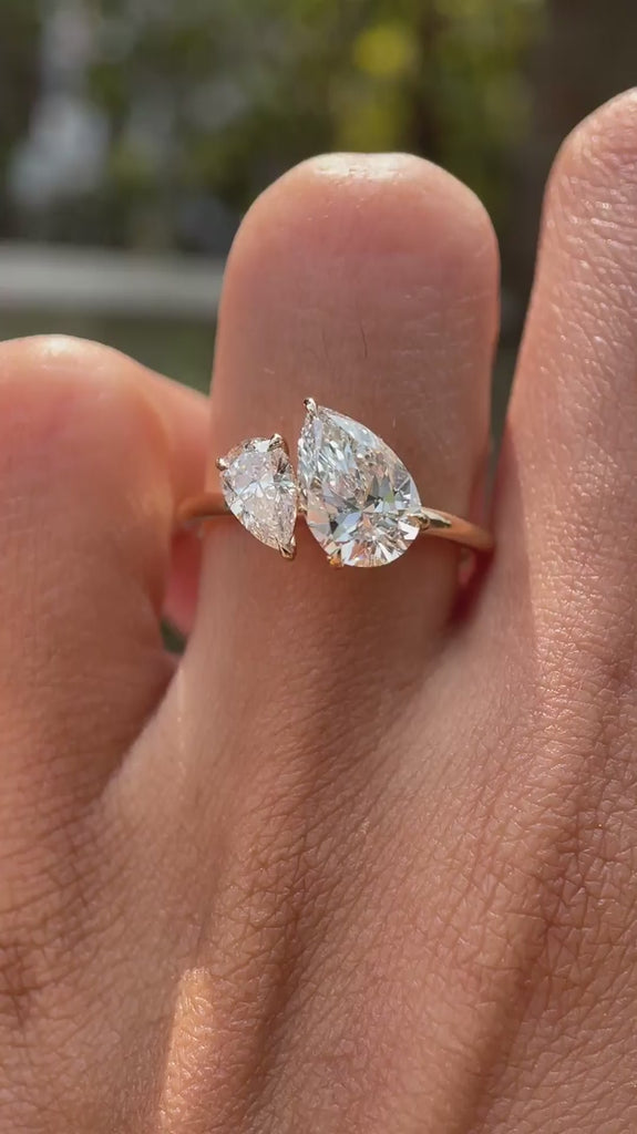 Two stone pear lab diamond ring on hand close up video