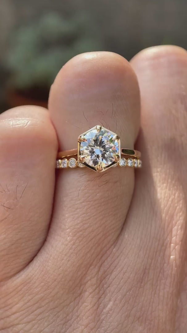 Video showing cathedral style round lab grown diamond engagement ring with bubble band in 14K yellow gold