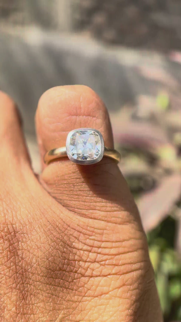 Dual tone cushion Old Mine Cut moissanite bezel solitaire ring rotating view