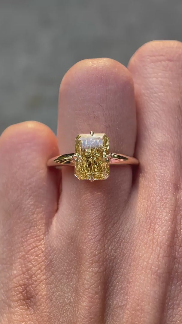 Radiant compass setting yellow engagement ring on hand video