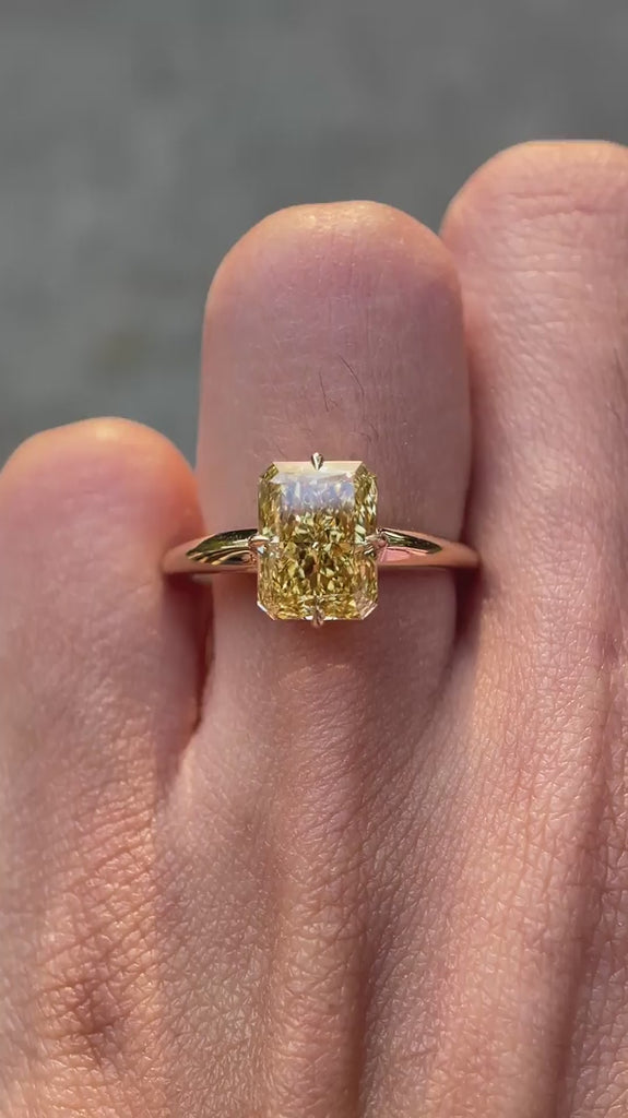 Radiant compass setting yellow engagement ring on hand video