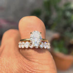 Rotating video showing oval moissanite solitaire with stack band