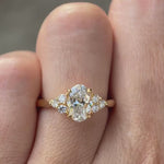 Oval lab grown diamond cluster engagement ring in 14K yellow gold shown from multiple angles
