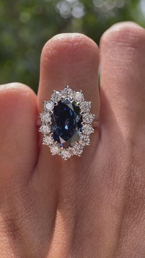 Oval blue moissanite and diamond halo wedding ring video