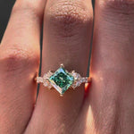360-degree view of the princess-cut green moissanite engagement ring.