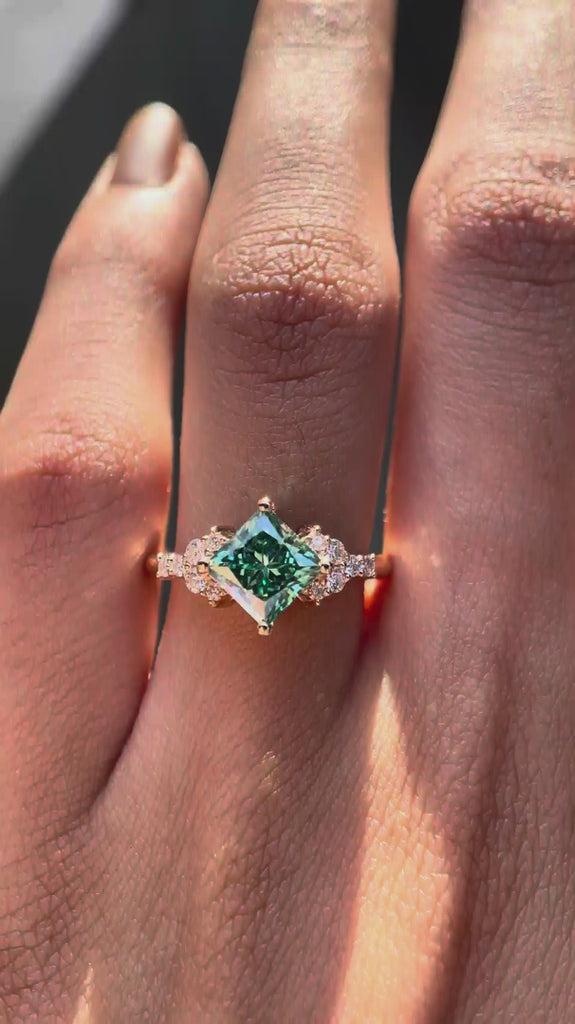 360-degree view of the princess-cut green moissanite engagement ring.
