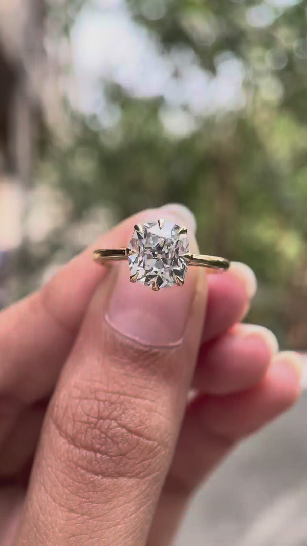 Video showcasing elongated cushion Old Mine cut lab grown diamond solitaire ring in 18K yellow gold