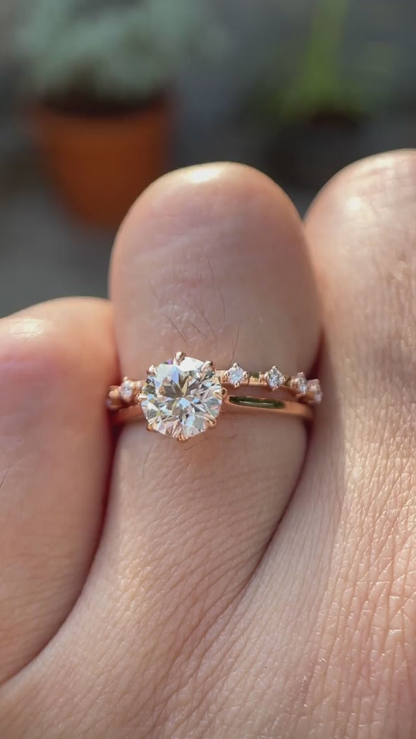 Cathedral style round lab grown diamond engagement ring with diamond accent band in 14K white gold