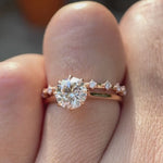 Cathedral style round lab grown diamond engagement ring with diamond accent band in 14K white gold