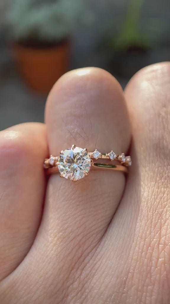 Cathedral style round lab grown diamond engagement ring with diamond accent band in 14K white gold