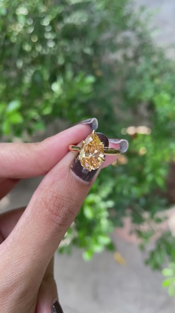 Tulip set pear dark champagne moissanite cathedral ring, floral bridge video