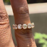Rotating view of worn on finger elegant seven stone band highlight uniform brilliance