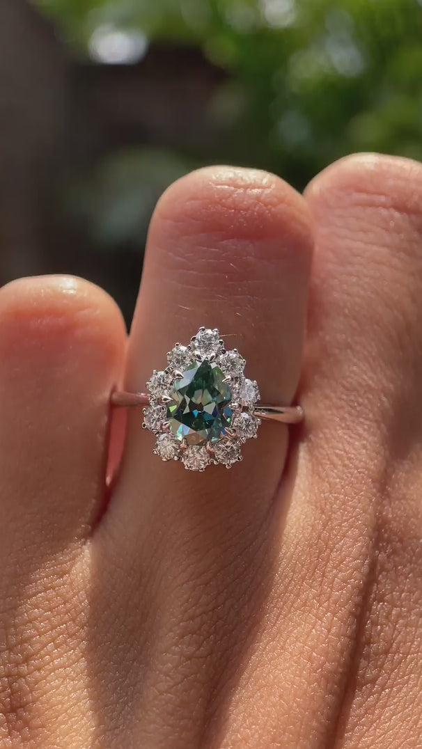 OMC pear shaped blue green moissanite halo wedding ring video