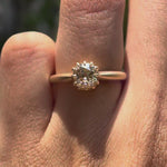 Elongated cushion Old Mine Cut light champagne moissanite solitaire ring in 10K yellow gold rotating view