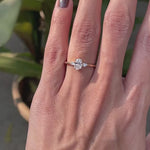 Minimalist oval diamond engagement ring with pear side stones video