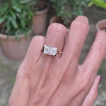 14k yellow gold east west radiant cut moissanite engagement ring featuring modern floating half bezel design
