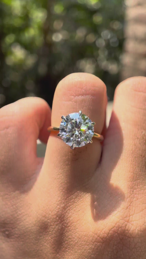 Rotating video showing round brilliant moissanite hidden halo ring