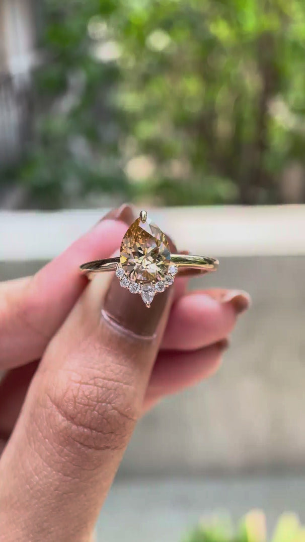 Pear champagne moissanite half halo engagement ring video