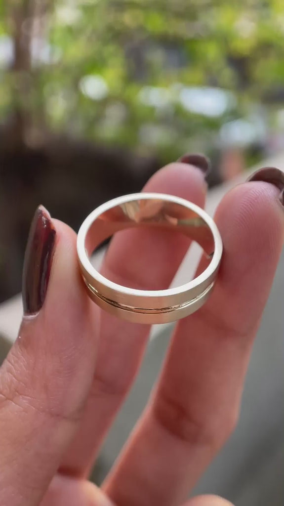 Plain yellow gold comfort fit wedding band with polished center groove video
