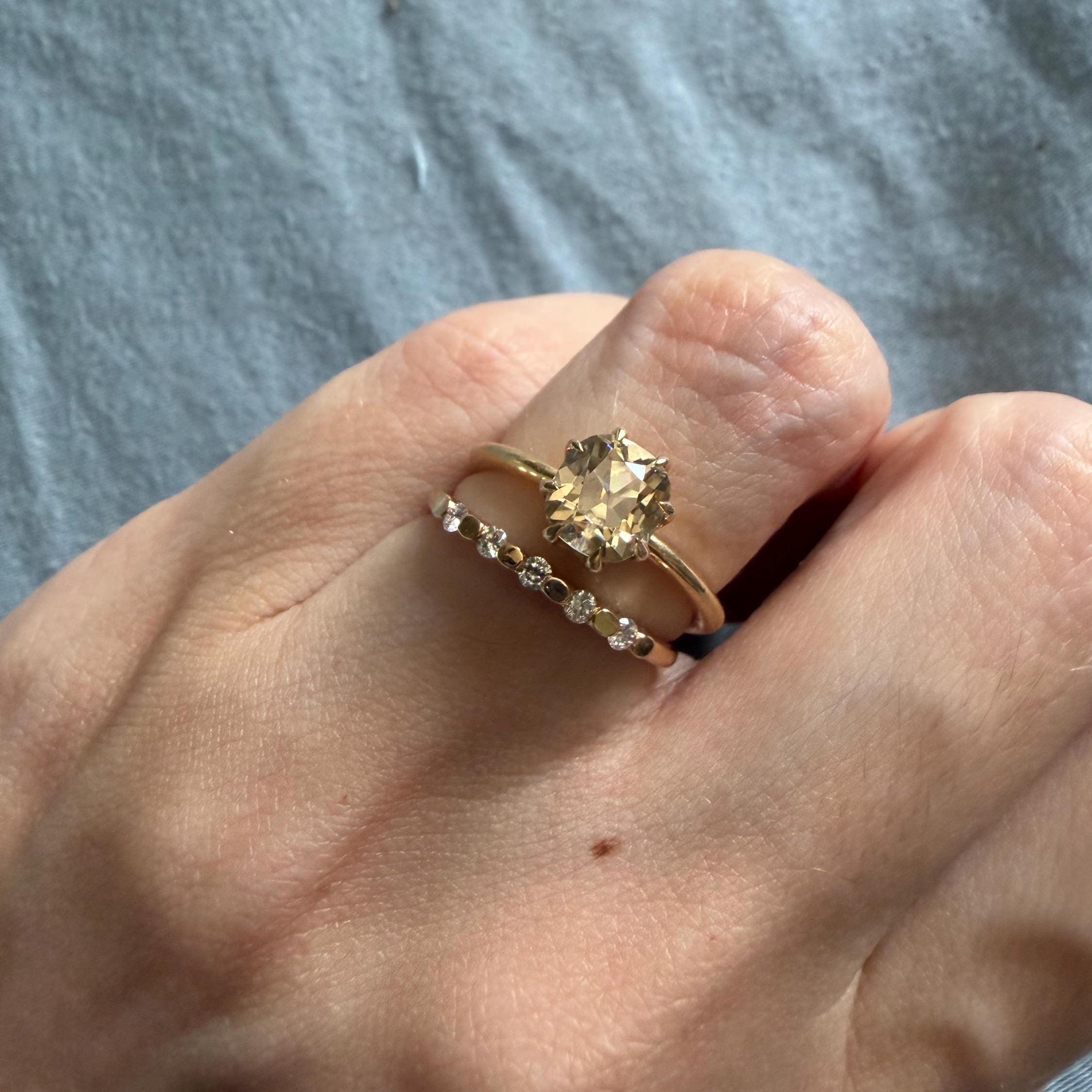 Customer photo of a custom Orbion wedding band, reviewed by Hayley on Etsy